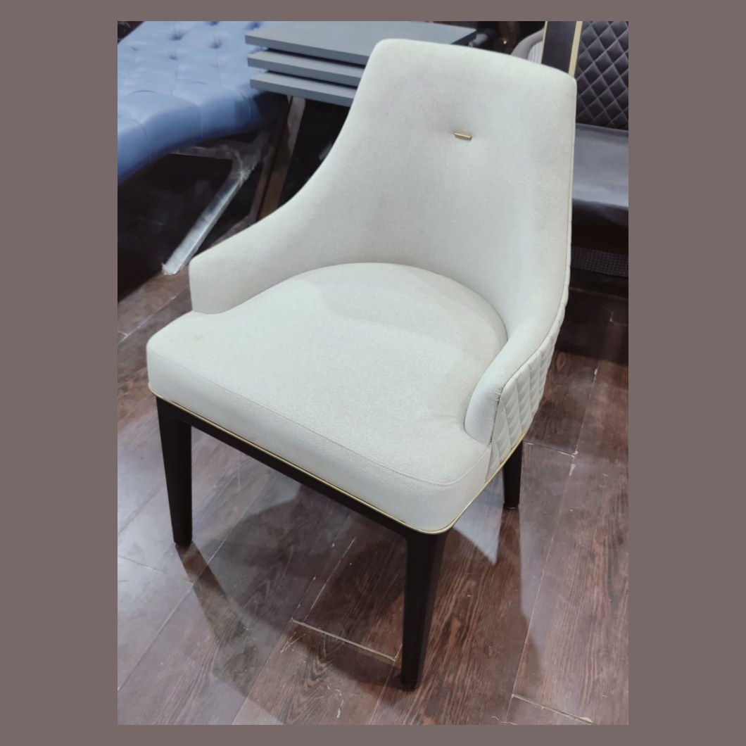 Upholstered dining chair with quilted back