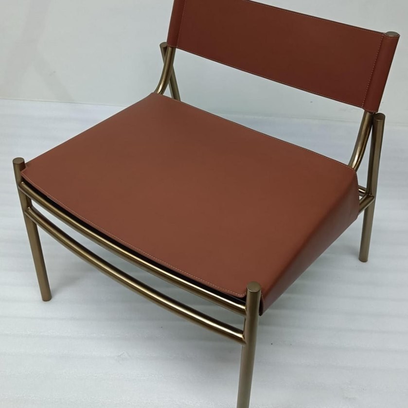 Leather lounge chair with brass frame