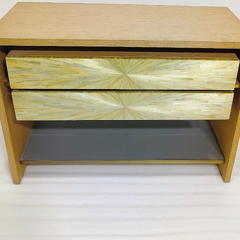 Oak chest with brass-front drawers