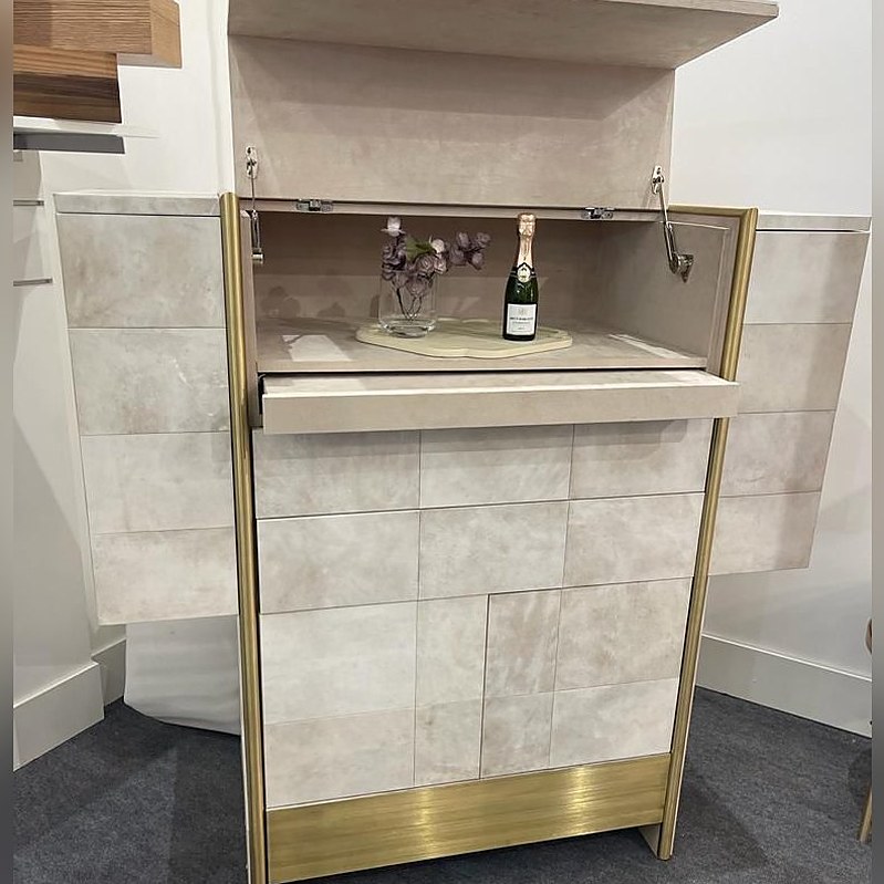 Bar cabinet with brass trim and fold-down top