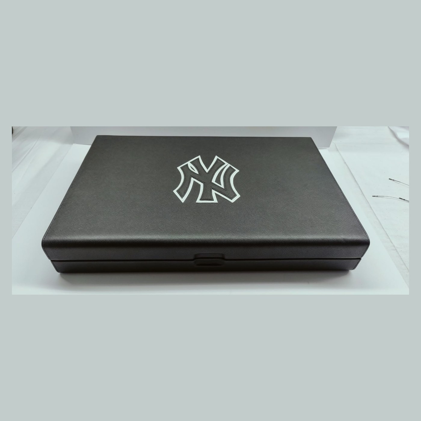 Grey leather case with embossed logo