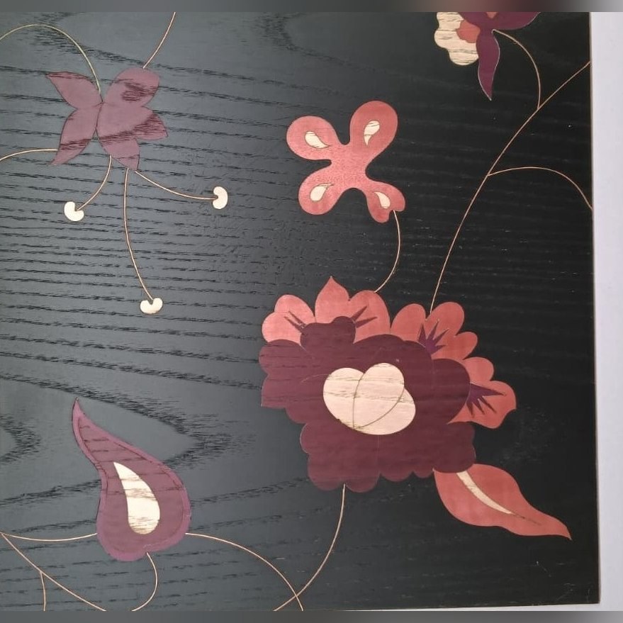 Floral inlay on black ash veneer
