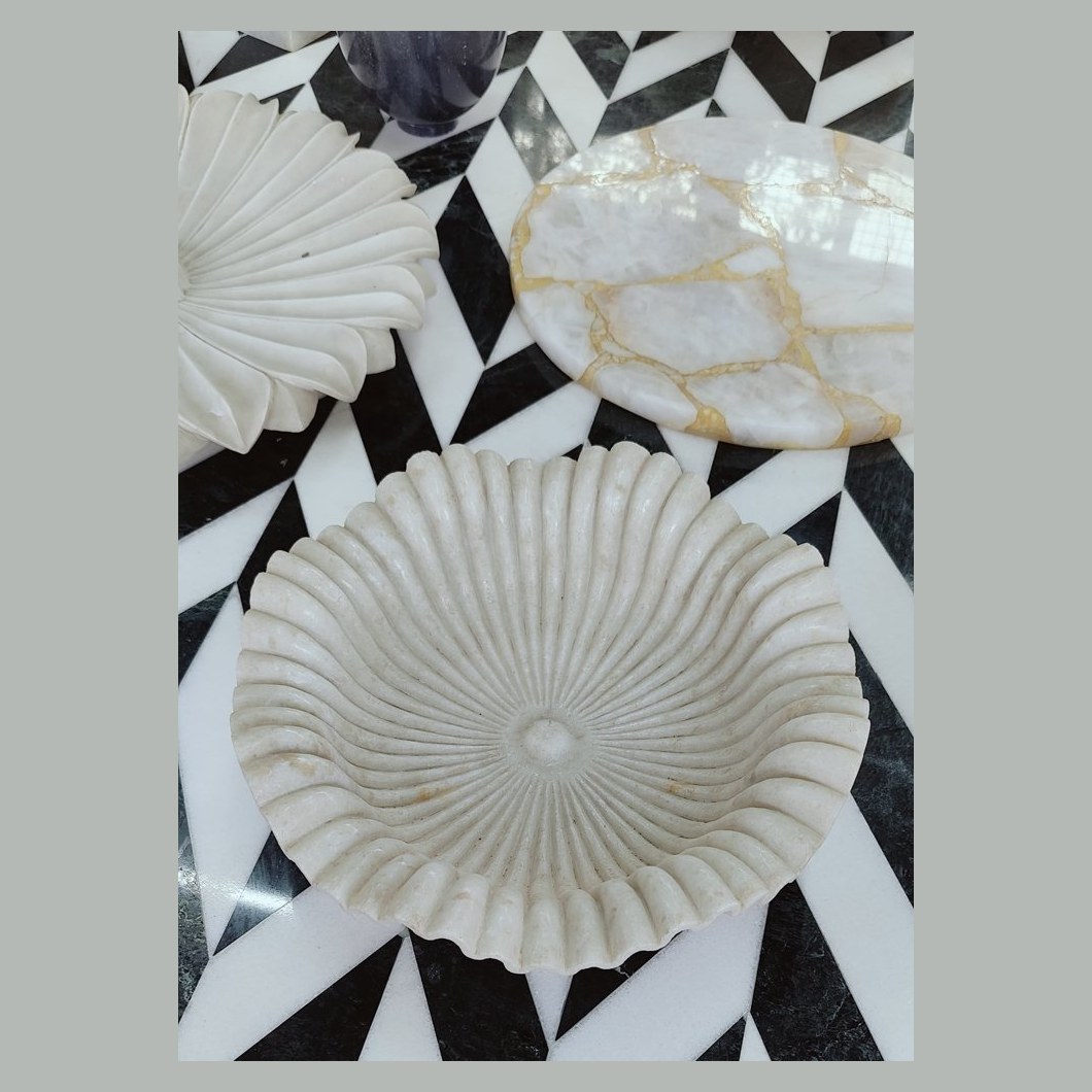 Carved marble bowl on stone inlay top