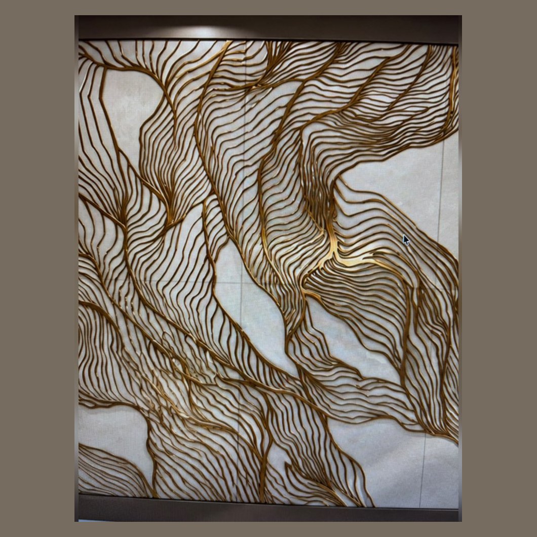 Brass wave line inlay on white stone
