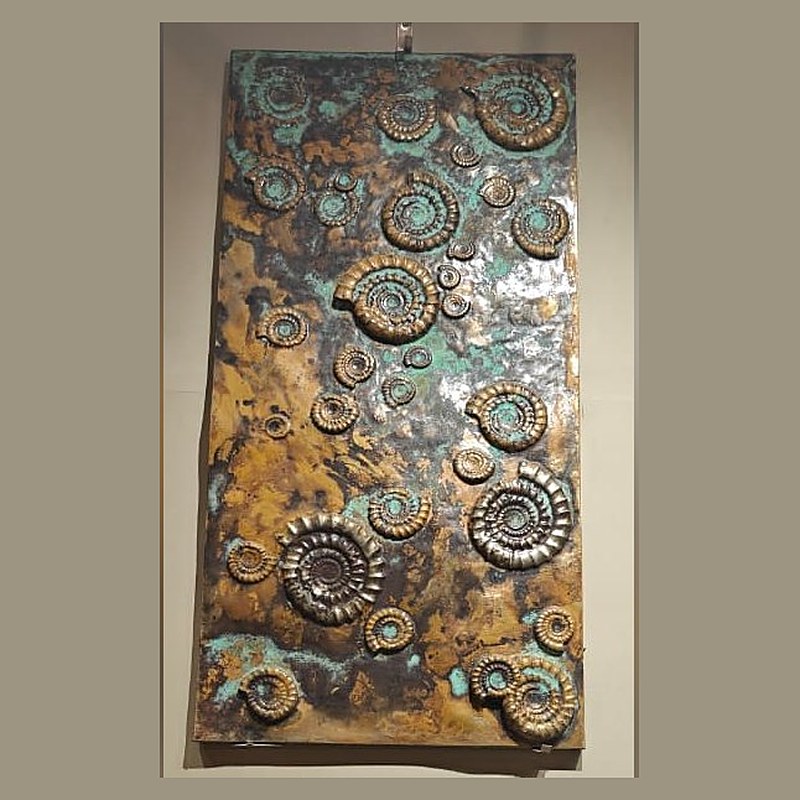 Fossil patina metal wall panel