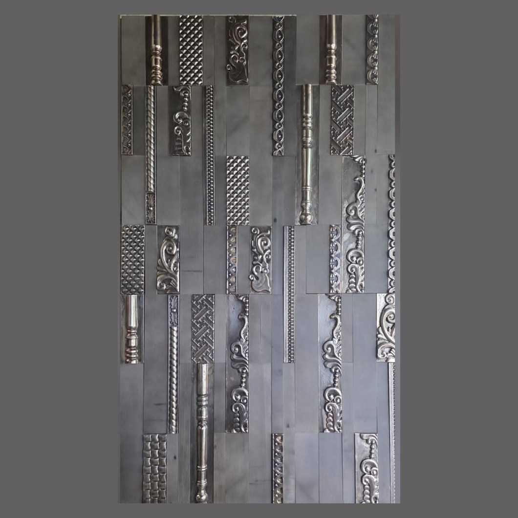 Embossed metal strip wall panel
