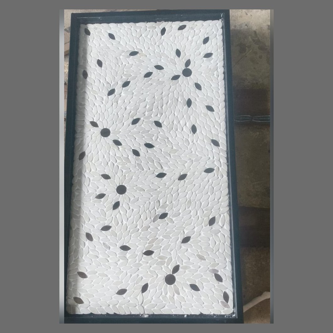 White stone panel with black leaf inlay