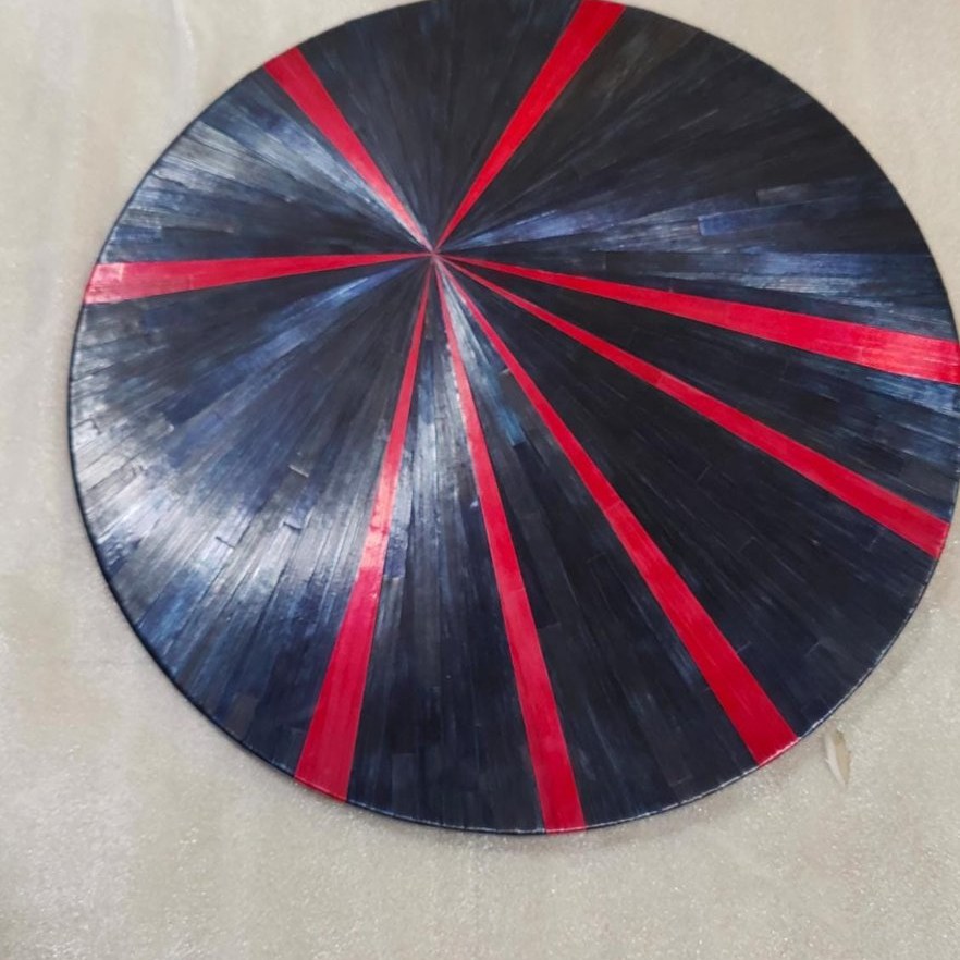Straw sunburst table top, red and black